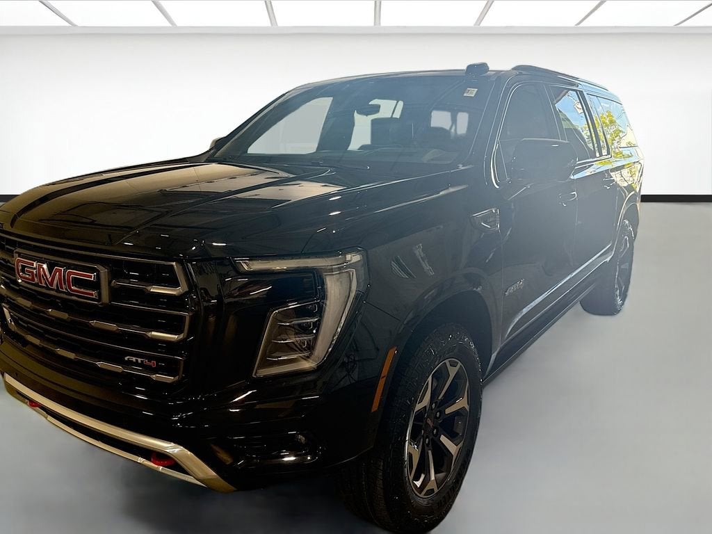 2026 GMC Yukon XL AT4 Ultimate in Onyx Black — front three-quarter view