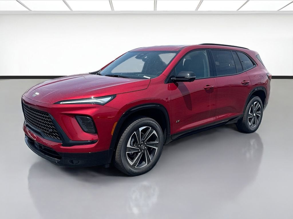 2026 Buick Enclave Sport Touring in Cherry Red Tintcoat — front three-quarter view