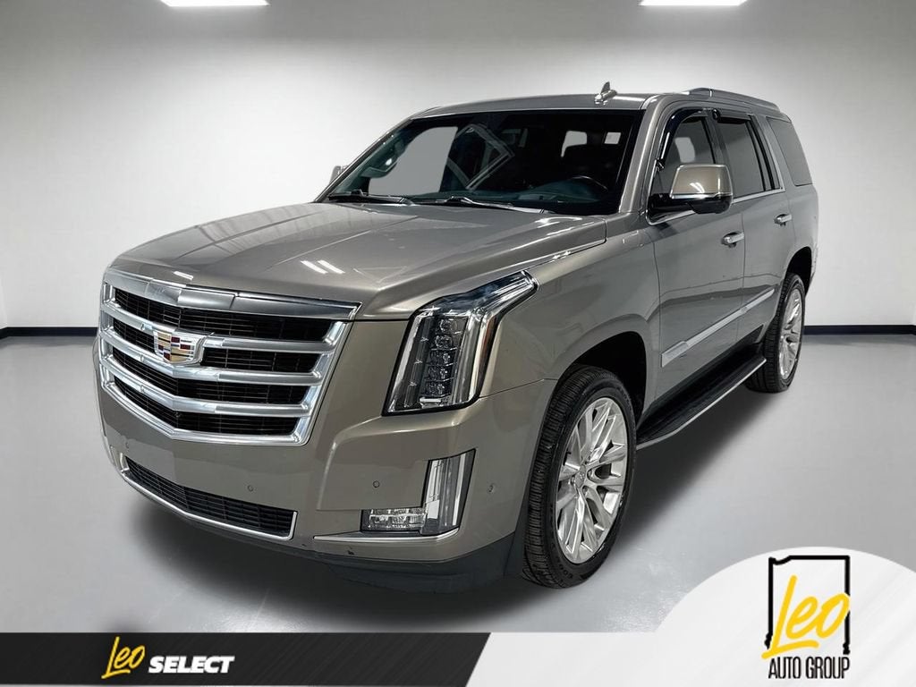 2017 Cadillac Escalade Luxury in Bronze Dune Metallic — front three-quarter view